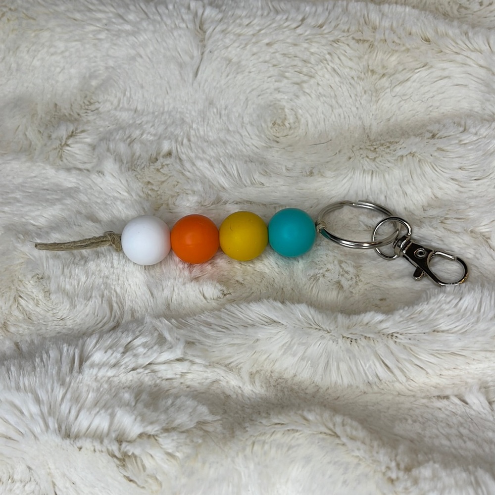 Handmade 15mm silicone bead keychain or zipper pull. Teal/yellow/orange/white.